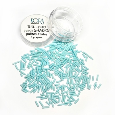 Frasco com palitos azuis e tampa com texto KORA proyecto