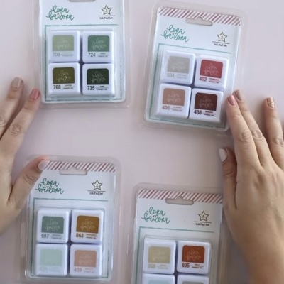 Conjuntos de tinta Lora Bailora com várias cores exibidas em embalagem plástica