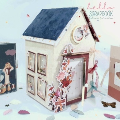 Conjunto de artigos de scrapbook com caixa em forma de casa, álbum azul e caixa bege com borboleta