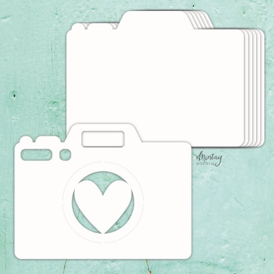 Recorte de papel em forma de câmara fotográfica com coração no centro