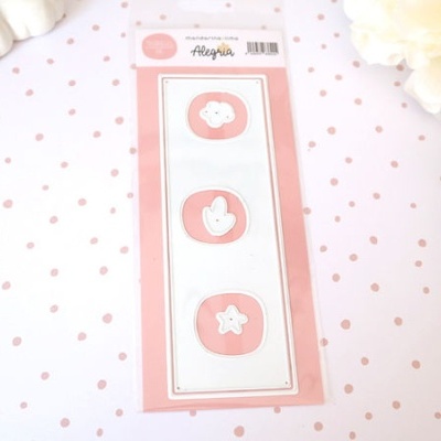 Autocolantes cor-de-rosa e branco com símbolos numa embalagem plástica sobre papel branco com pontos cor-de-rosa.