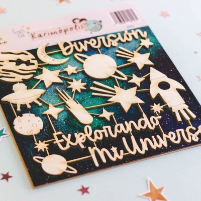 Autocolantes de madeira com tema espacial e texto, em fundo azul com glitter