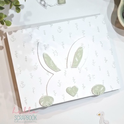 Álbum com capa decorada de coelho e desenhos flores e regadores