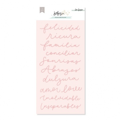 Autocolantes decorativos com palavras em letra cursiva castanha sobre fundo rosa claro