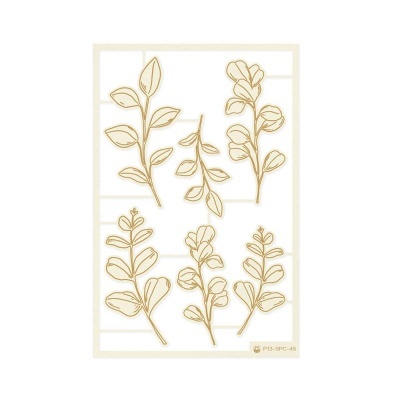 Carimbos de silicone com desenhos de ramos e folhas em dourado sobre moldura branca