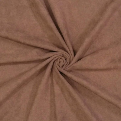 Tecido castanho claro com textura de camurça enrolado em espiral