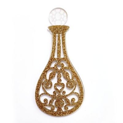 Decoração em forma de garrafa dourada com glitter e tampa branca sobre fundo branco