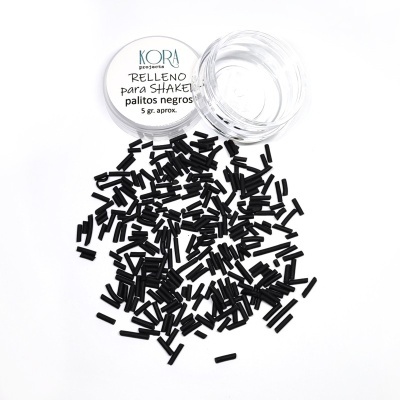 Recipiente transparente com tampa branca e pequenos palitos negros espalhados