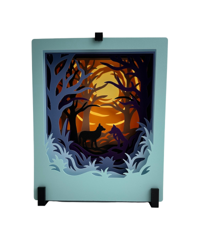 Quadro decorativo em camadas de papel com cães e bosque ao pôr do sol