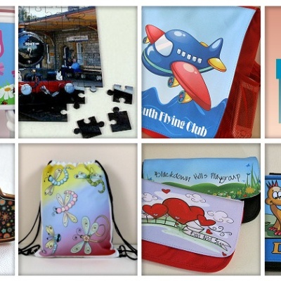 Produtos infantis variados incluindo caixa com nome, brinquedo, almofada, saco e livro de dinossauros