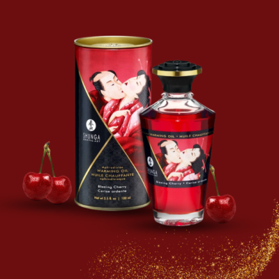 Frasco de óleo afrodisíaco Shunga Blazing Cherry com embalagem e cerejas