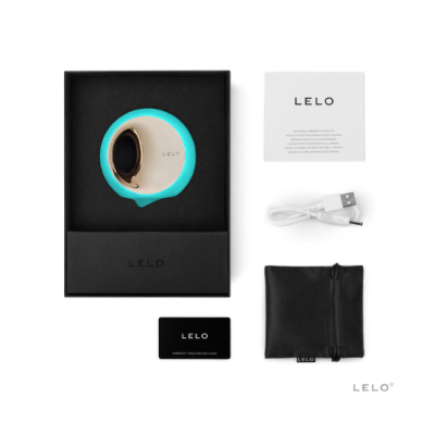 Produto LELO com dispositivo circular azul e dourado, acessórios e embalagem