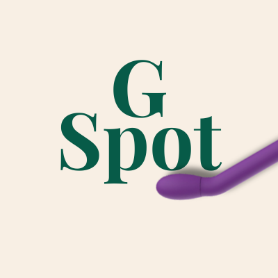 Vibrador roxo curvo com texto G Spot em fundo bege