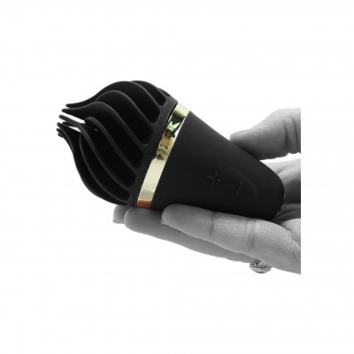 Dispositivo preto portátil com detalhes dourados e botões + e -