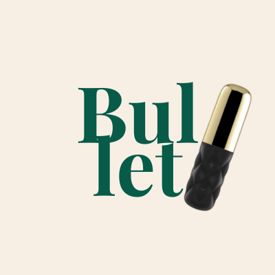 Vibrador bullet preto e dourado sobre fundo bege com texto ‘Bullet’