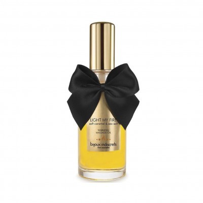 Frasco de óleo de massagem com tampa dourada e laço preto