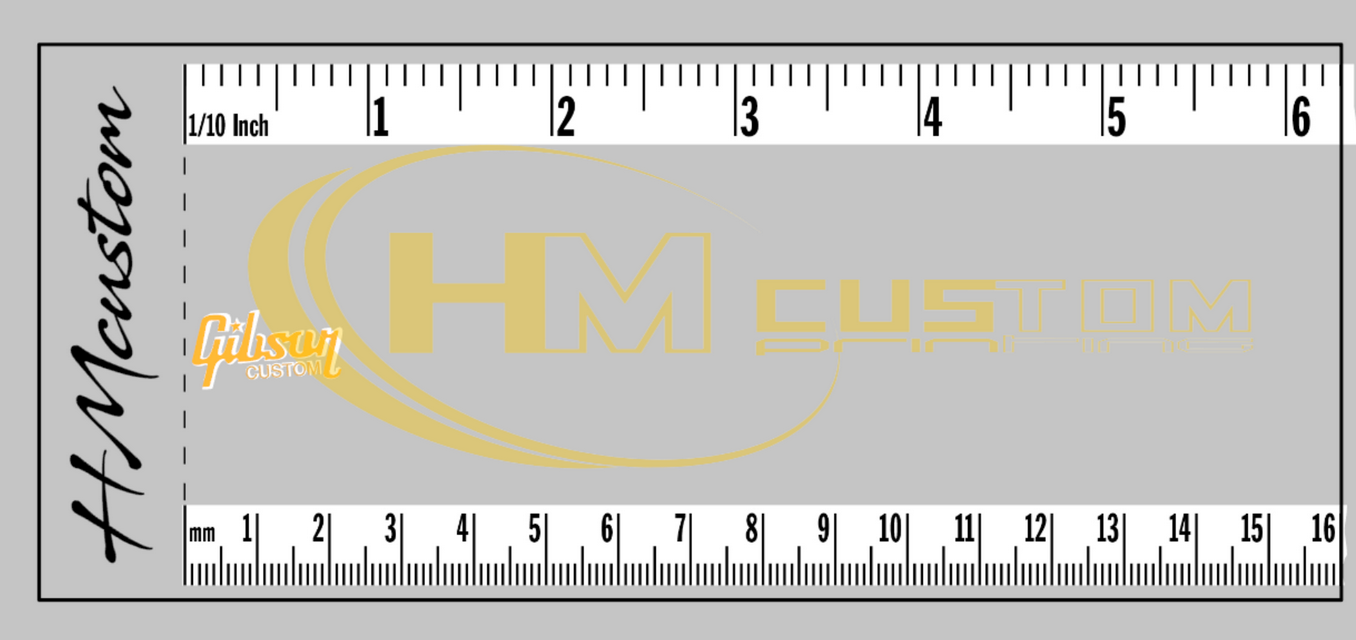Logo Gibson Star Custom em vinil adesivo dourado e branco Régua cinza com marcações em preto e logos HM CUSTOM e Gibson CUSTOM amarelos