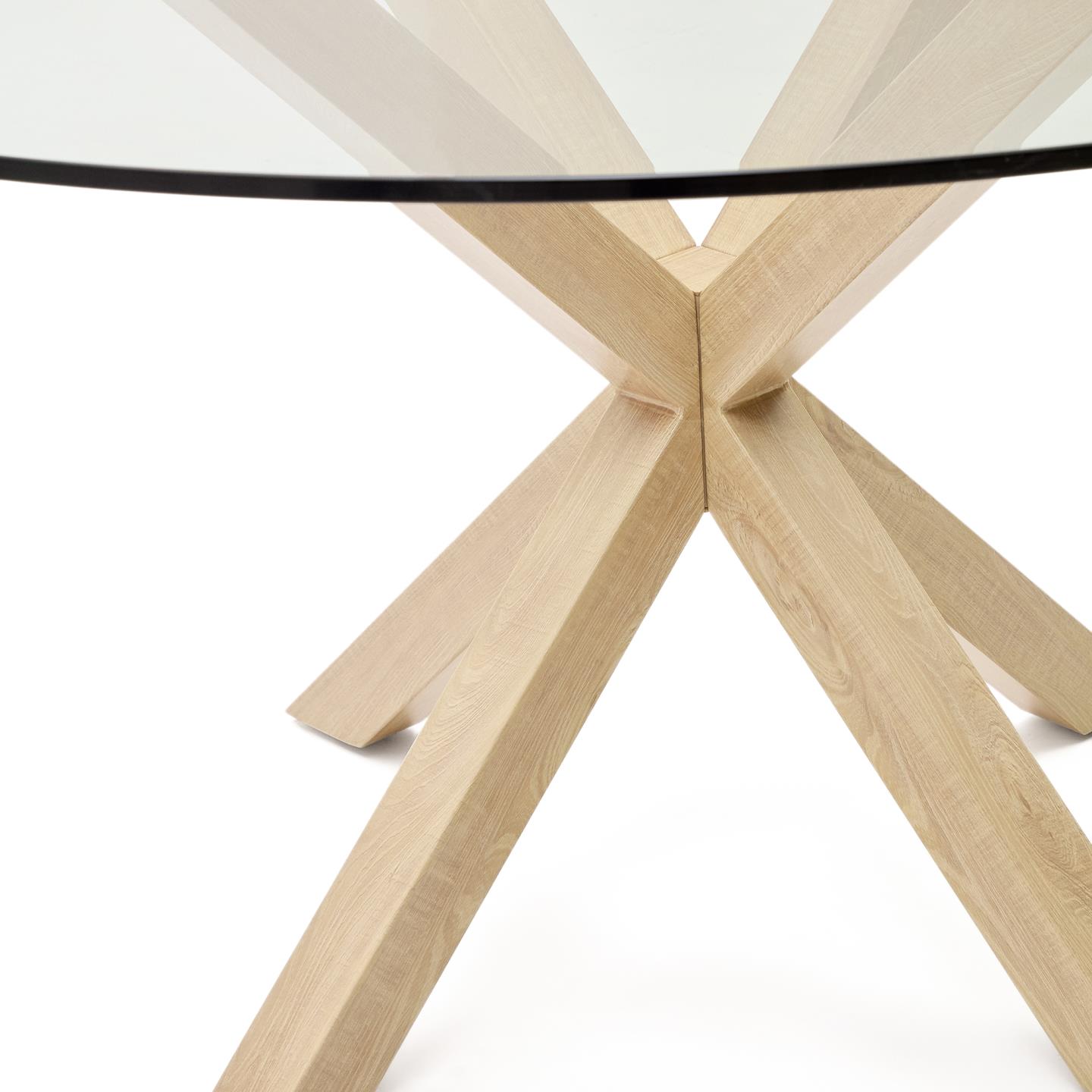 Mesa de jantar Arge, vidro/metal, Ø150X75 Mesa com tampo redondo de vidro e base de madeira clara entrelaçada