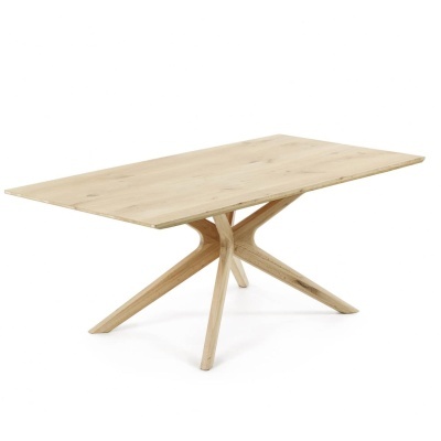 Mesa de madeira clara com tampo retangular e base de quatro pernas curvas.