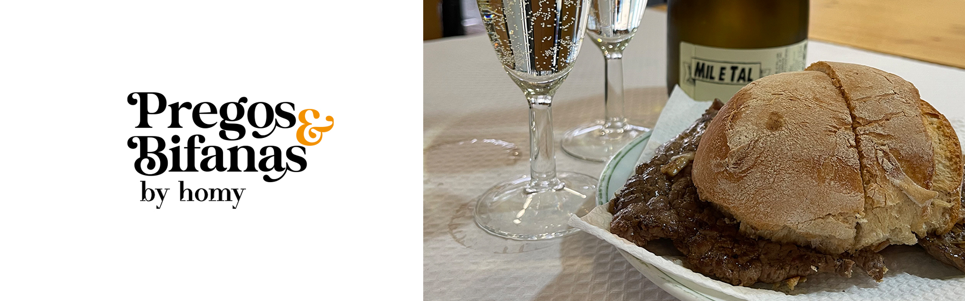 Sanduíche de bifana num pão rústico com carne, taças de champanhe e garrafa 'NoE Talk'