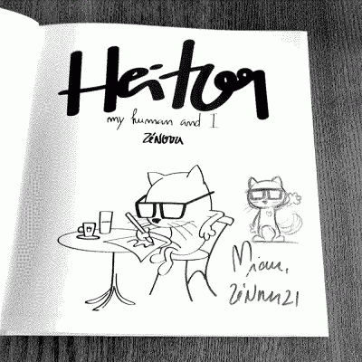 Ilustração a preto e branco com gato a desenhar, texto 'Heitoon my human and I ZENZOTA' e autógrafo 'Miau, ZENZ21'