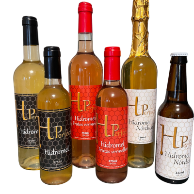 Seis garrafas de hidromel e uma de cerveja LPerfect com rótulos coloridos e padrão hexagonal.
