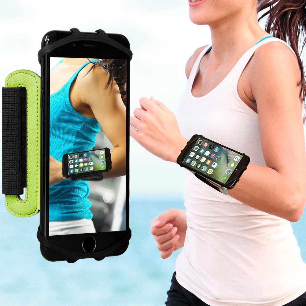 Sports Armband Universal / Bolsa Desportiva Forearm Suporte para smartphone preto com detalhes verdes usado no braço durante corrida à beira-mar