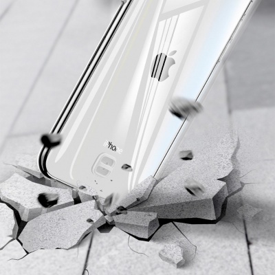 smartphone branco iPhone 8 Apple a cair no chão rachado em cimento cinzento