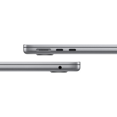 Portátil prateado visto de lado com portas USB-C, porta magnética e porta de áudio