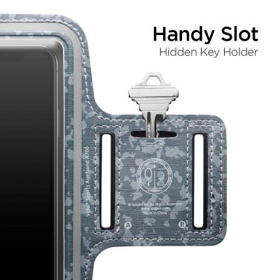 Suporte para chave escondida cinzento com padrão camuflado ao lado de suporte para dispositivo