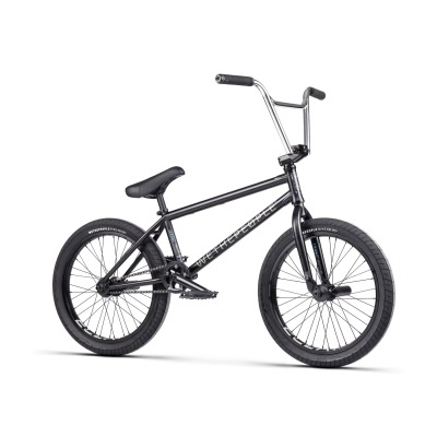 Bicicleta BMX negra com pneus grossos e guiador preto