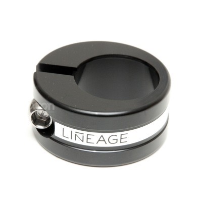 Anel de metal preto com parafuso e texto LINEAGE