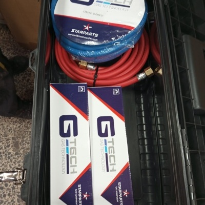 Caixa preta com mangueiras vermelhas e embalagens GTECH Gas Technology STARPARTS