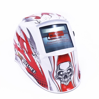 Máscara de soldadura com crânio e texto de aviso no visor