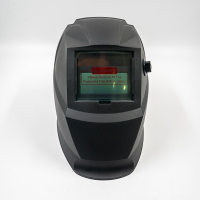 Máscara de soldadura preta com viseira e etiqueta de aviso