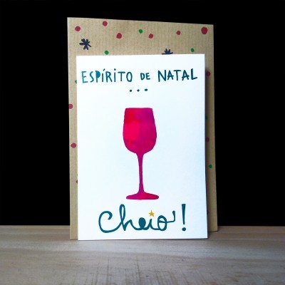 Cartão de Natal com copo de vinho vermelho e texto em azul