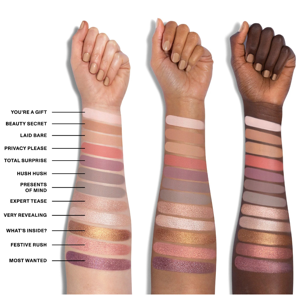 Paleta de Sombras 35te Tease The Season Artistry Palette Morphe Swatches de maquilhagem em três tons de pele diferentes com etiquetas de cores.