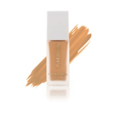 Frasco de base líquida Koffi Beauty com texto dourado sobre base bege e tampa branca