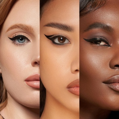 Três rostos femininos com diferentes tons de pele e maquilhagem destacada nos olhos e lábios