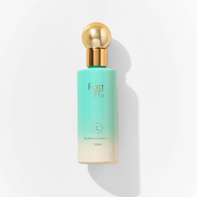 Frasco de produto cosmético azul turquesa com tampa dourada e texto em dourado