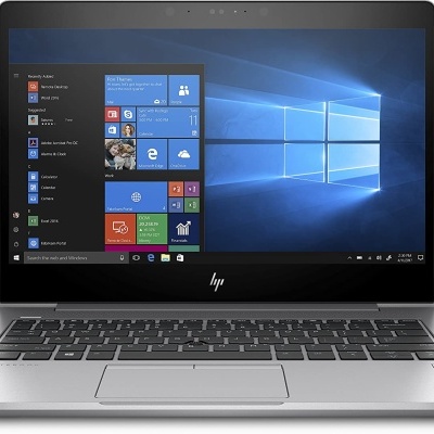 Computador portátil HP prateado com ecrã e teclado visíveis