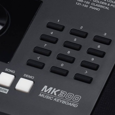 Teclado musical MK300 com botões numéricos e botões brancos com texto