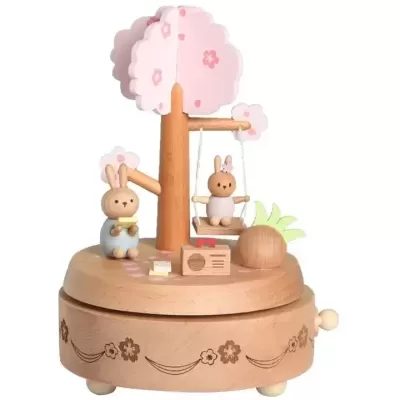 Caixa de música de madeira com figura de coelhos e árvore rosa
