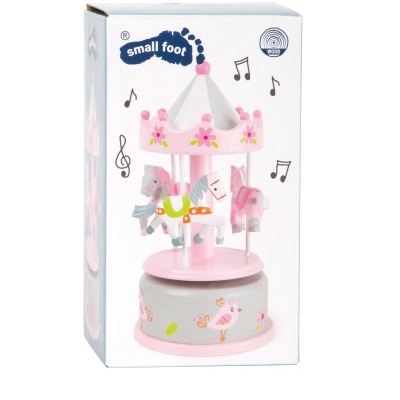 Brinquedo carrossel musical em madeira com design floral e cavalos coloridos