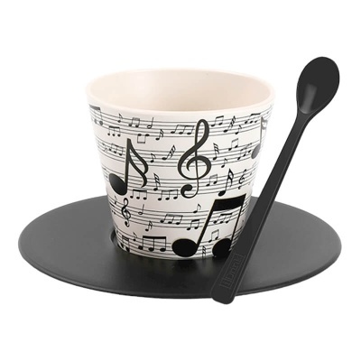 Chávena de cerâmica com notas musicais, pires e colher preta