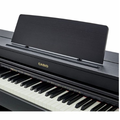 Piano digital preto CASIO com teclado e suporte de partituras