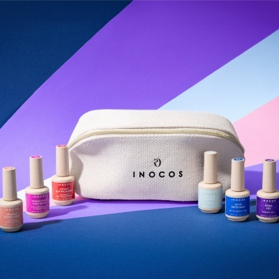 Necessaire bege texturada com vernizes gel de várias cores