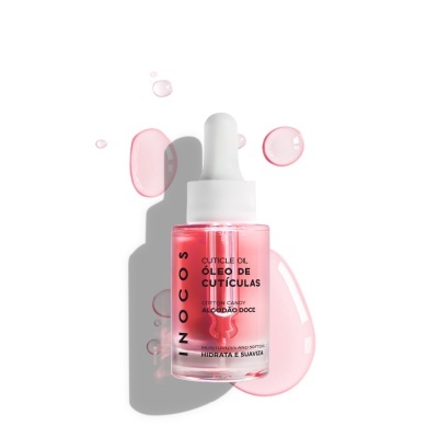 Frasco de óleo de cutículas rosa com conta-gotas branco e texto preto sobre fundo branco com gotas do produto.