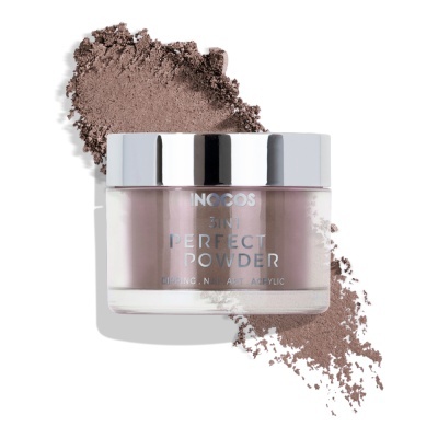 Frasco de pó solto INOCOS Skin Perfect Powder castanho com tampa metálica prateada e pó espalhado do mesmo tom