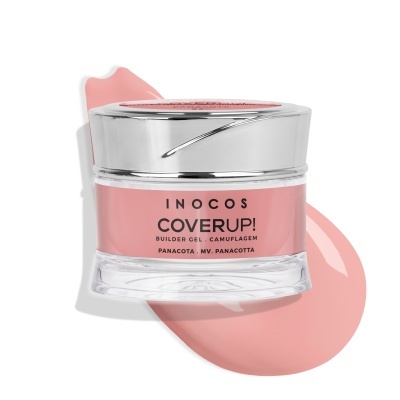 Frasco de gel construtor para unhas INOCOS cor rosa pálido com tampa prateada e texto na frente, sobre mancha rosa